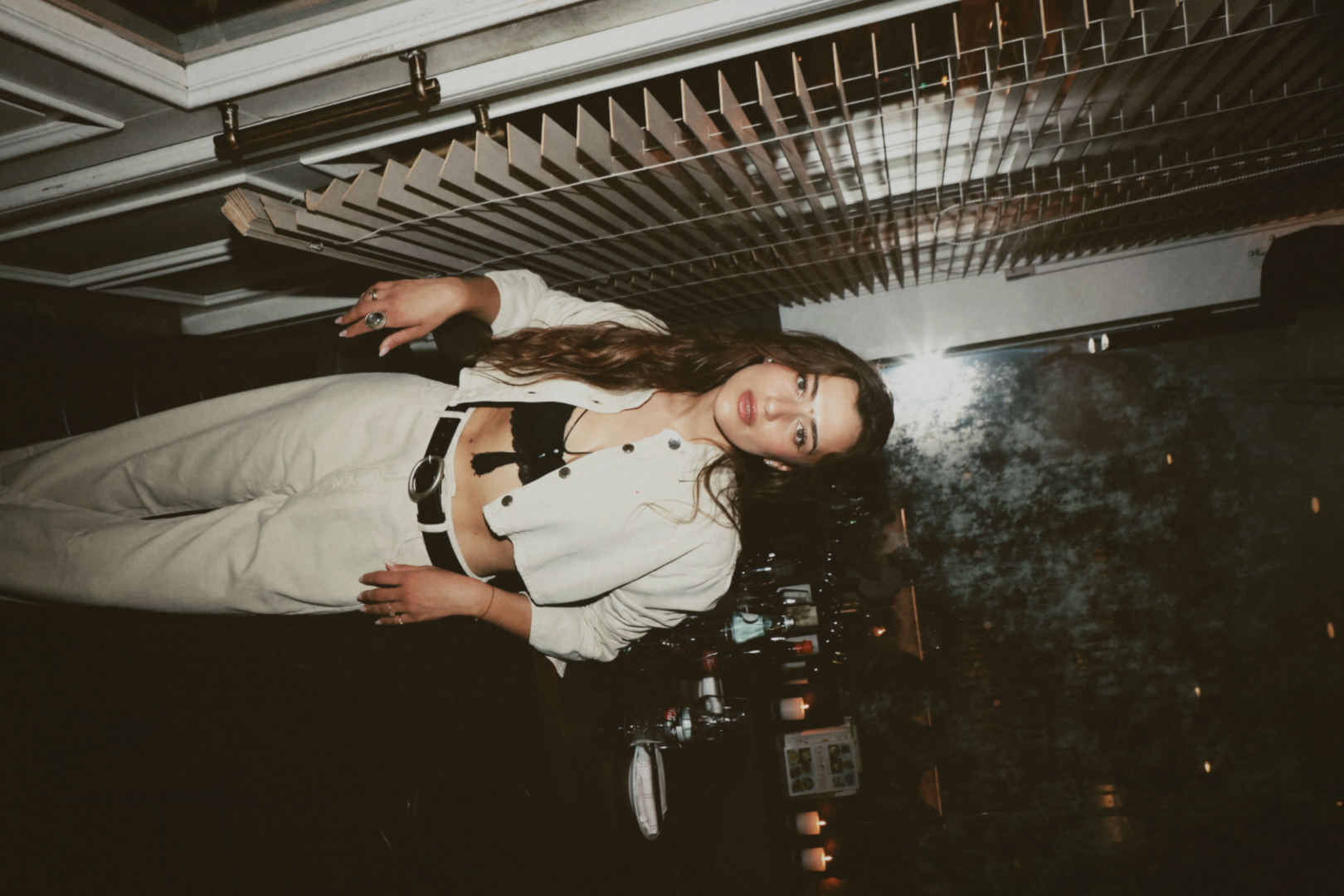Gal Malka's birthday — portrait by the window blinds in a cream jacket