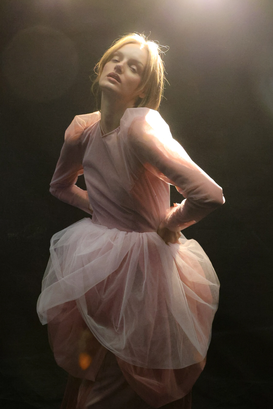 Fashion Week 2025 — model in a pink tulle look under stage light
