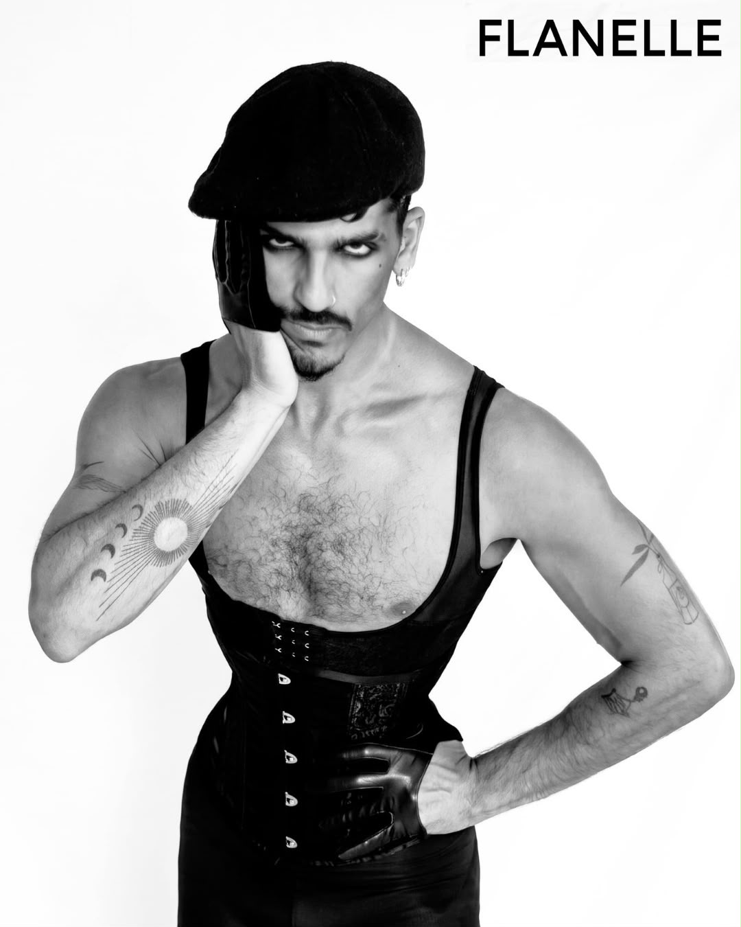Black and white portrait in a leather corset and cap, FLANELLE editorial